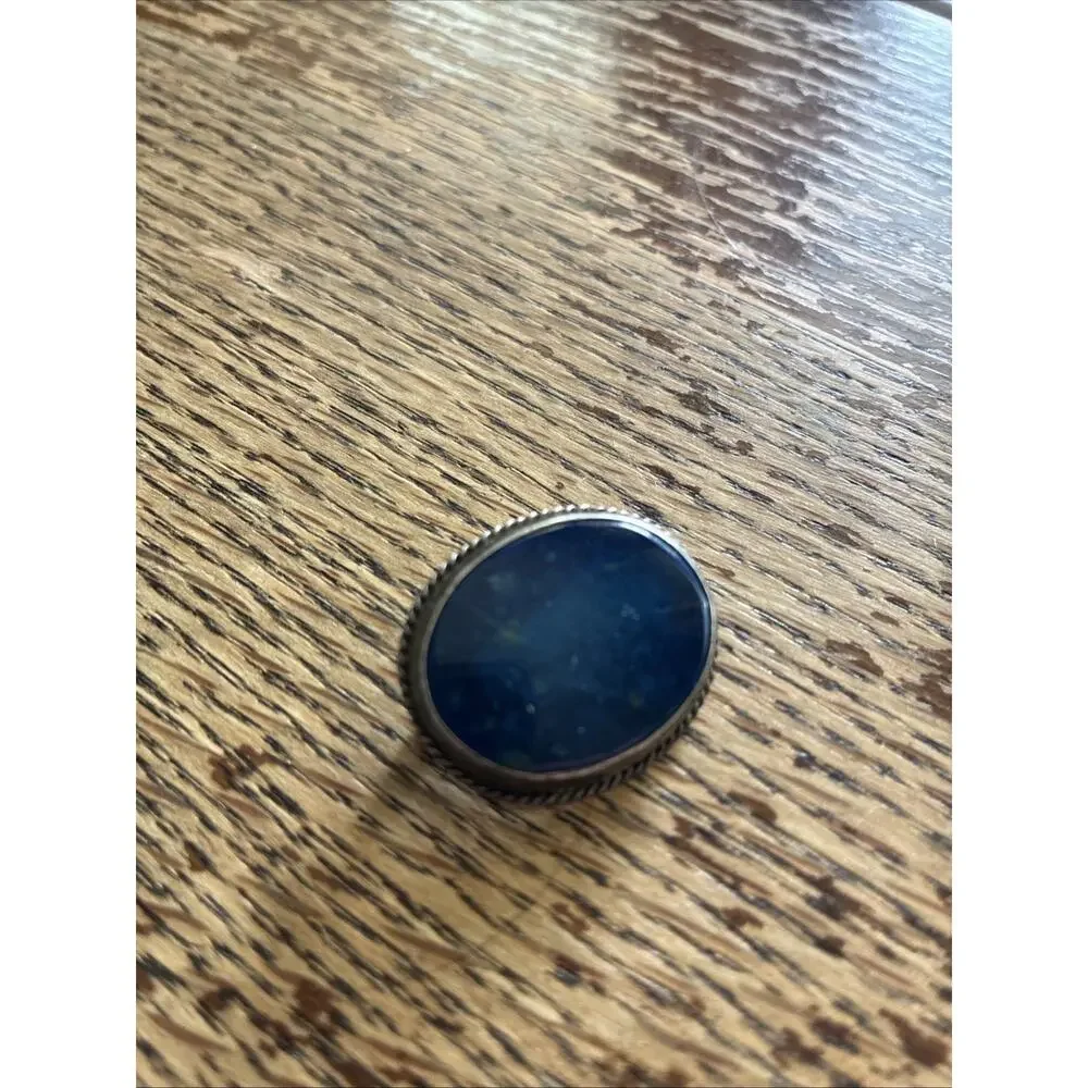 A Vintage Navajo Sterling Silver Sand Cast Brooch With A Lapis Cabochon